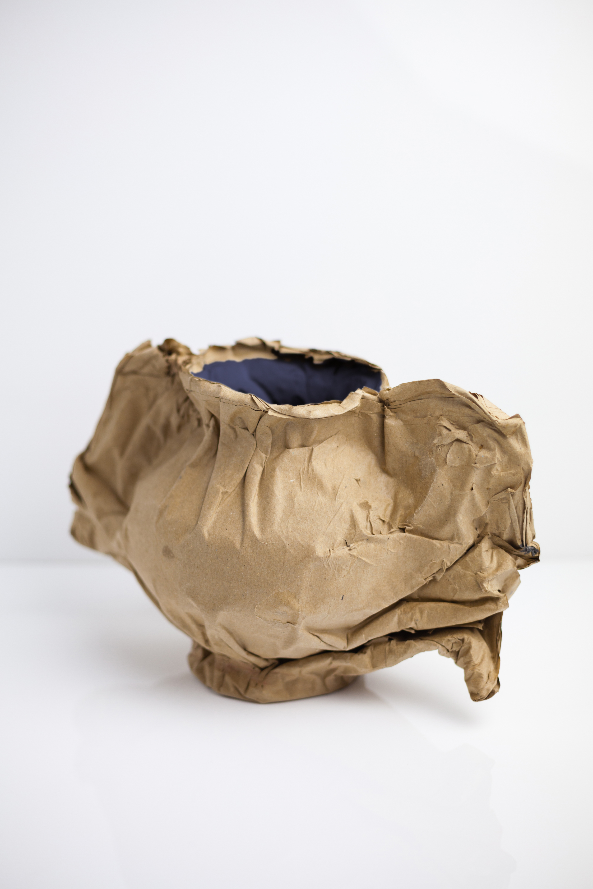 'Sketch Objects’ is an experiment with the paper using various layering, folding and moulding techniques. Through using these methods, an unstable material become stable and flexible to create any shapes and forms. The wrinkled, torn and creased surfaces, rippled edged, expressing the physical sensations and poetic associations that the objects arouse. The thought provoking ‘sketch objects’ heighten viewer’s curiosity and challenge the perception of value. Photo www.ianbartlett.com