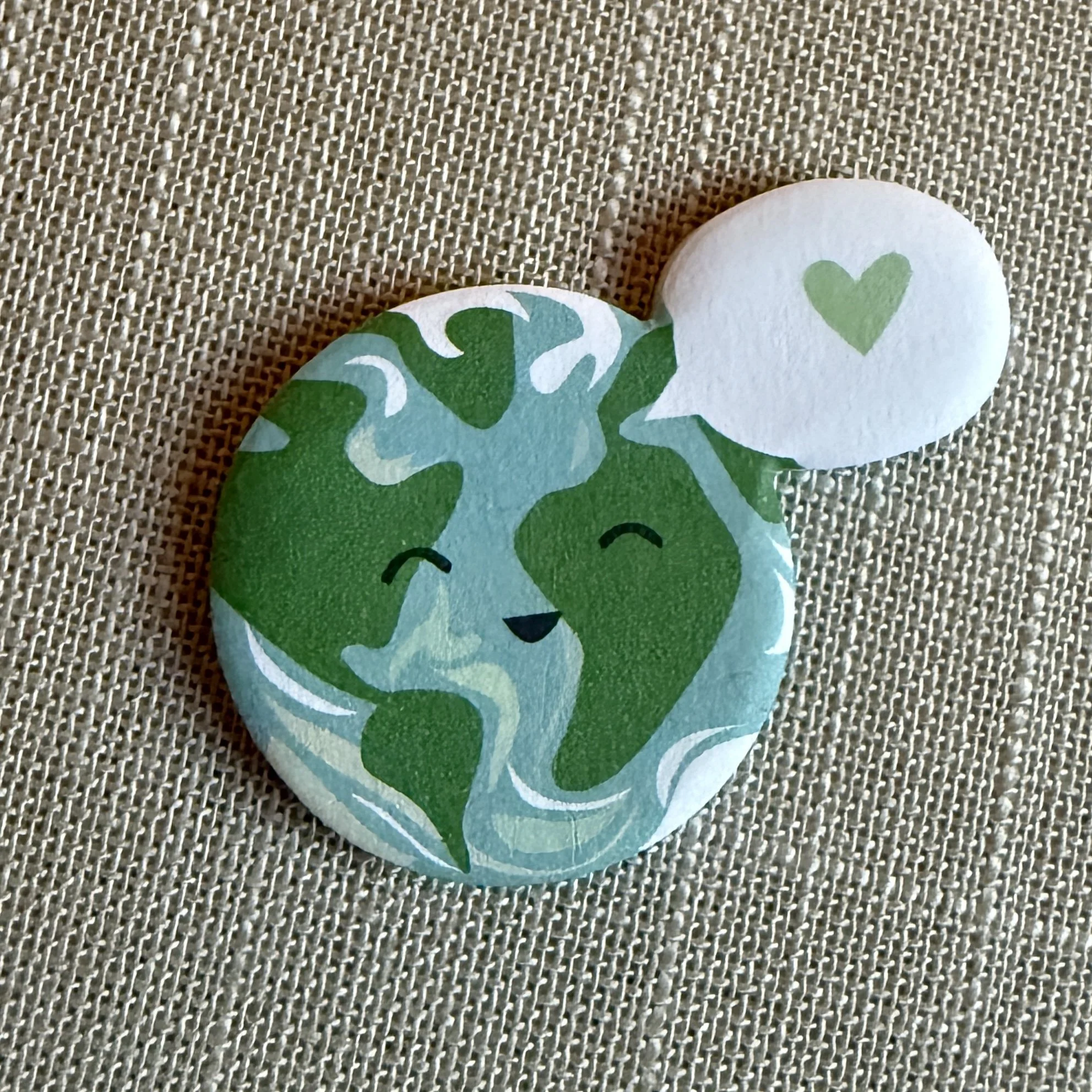 Smiling Earth sticky notes on a textured background