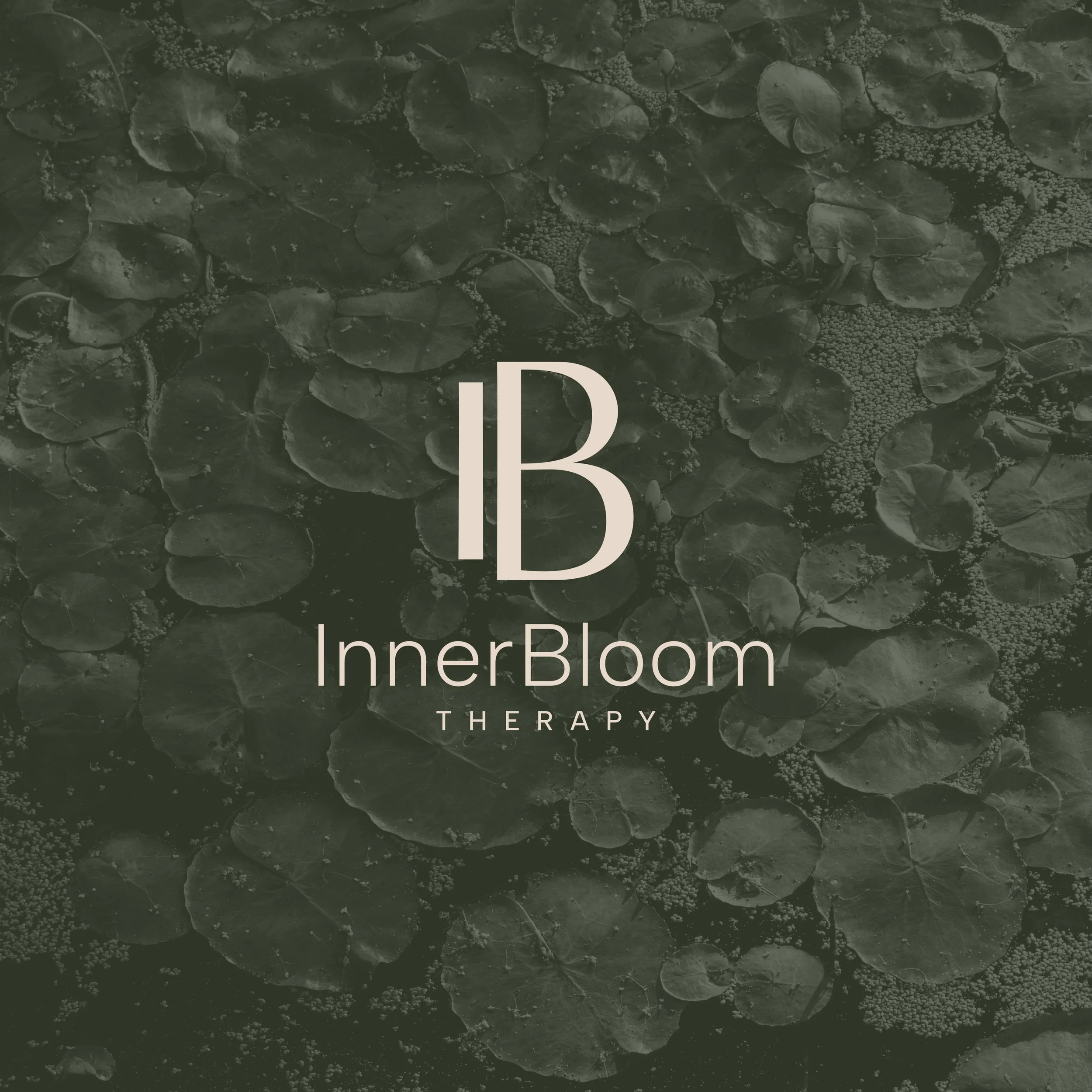 InnerBloom Therapy Chicago Practice Logo with monogram by Dorey Kronick laid over a muted green photo of lily pads on water