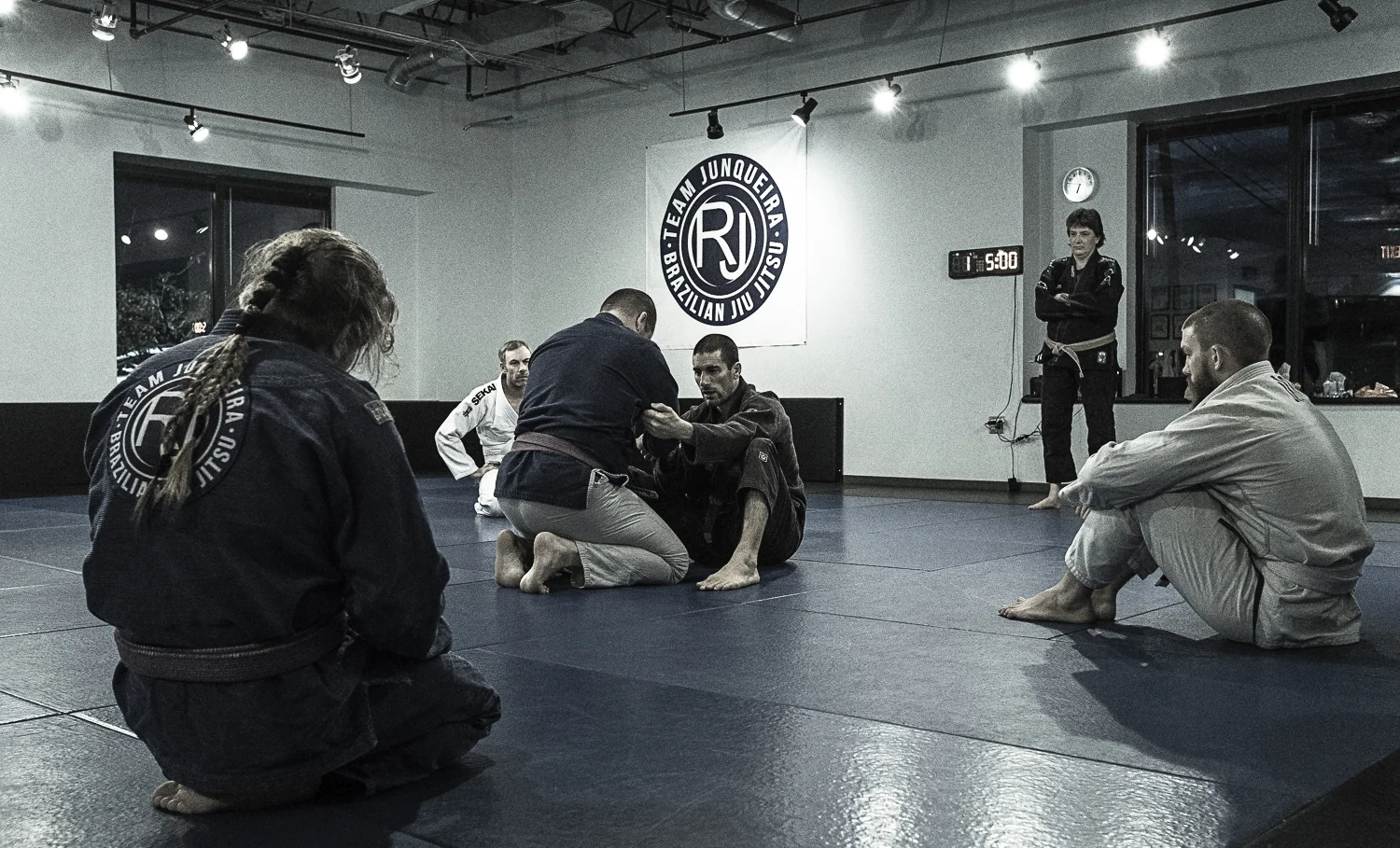 Chris Dube - Brown Belt Chris Dube is a brown belt who teaches the children's competition classes as well as the noon adult classes. Before joining Team Junqueira in 2015, Chris trained at Gracie Barra Orlando under Marcio Simas. Chris is also a former NCAA Division 1 athlete and is a black belt in Taekwondo under Grandmasters T.H. Kim and Young Bo Kong.