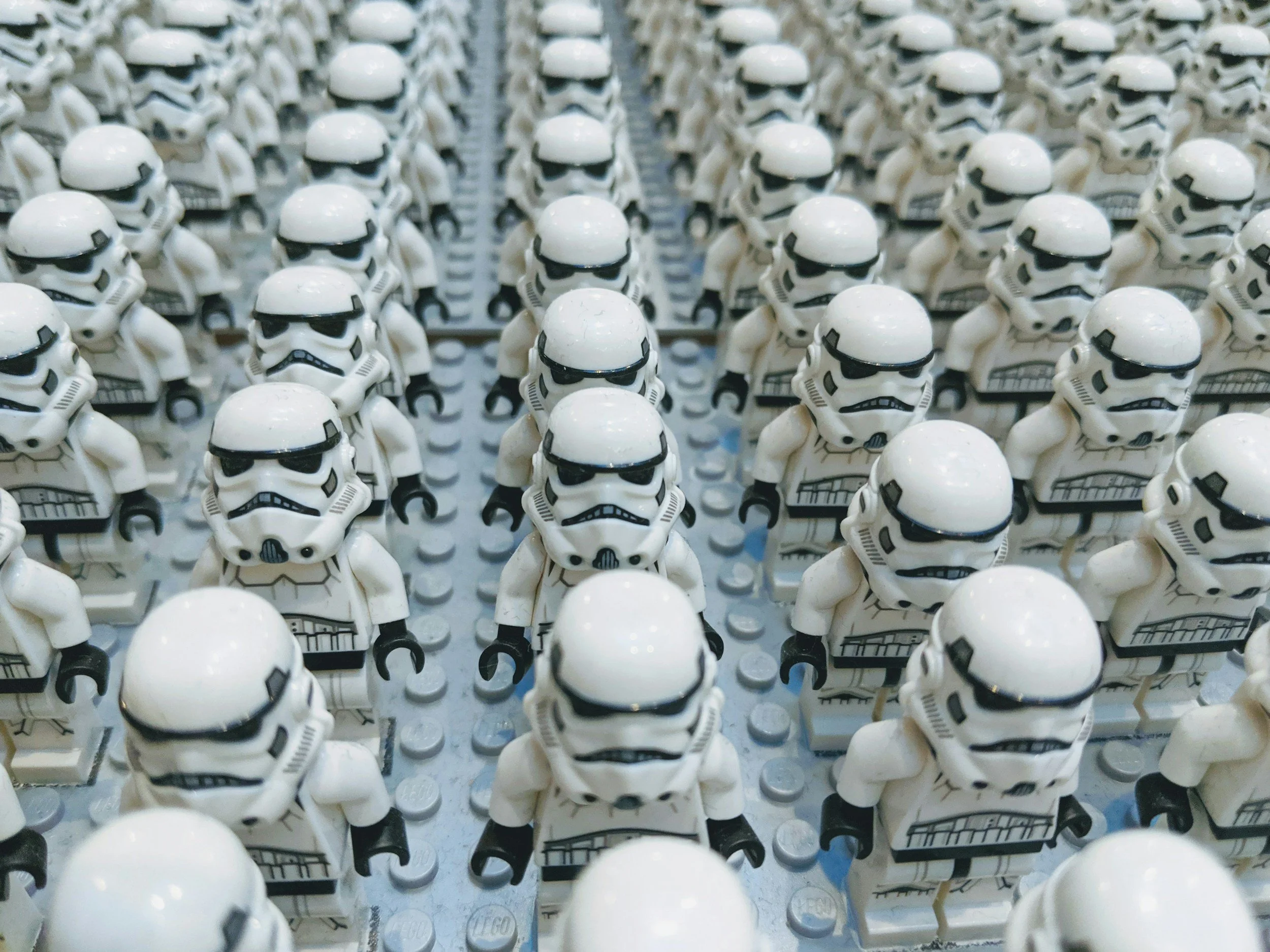 A collection of Lego Star Wars stormtroopers in formation