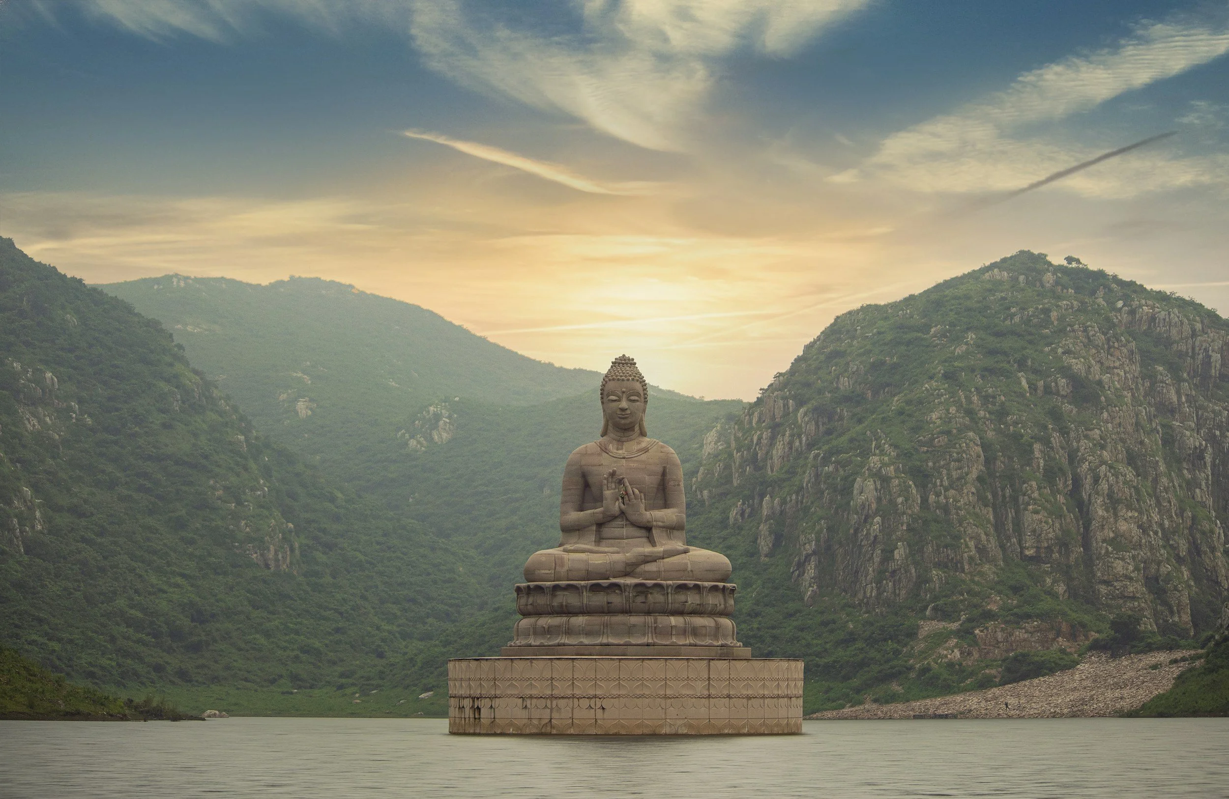 A statue of the Buddha on a mountain