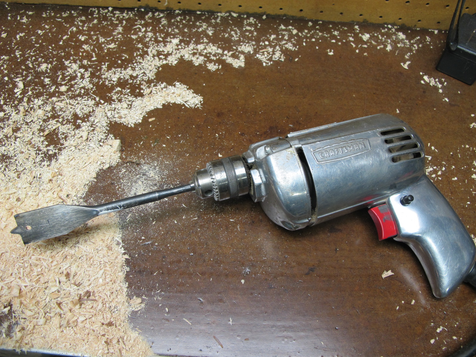  Use electric drill with 1-1/4" bit to bore a hole in the bottom 4" deep. 