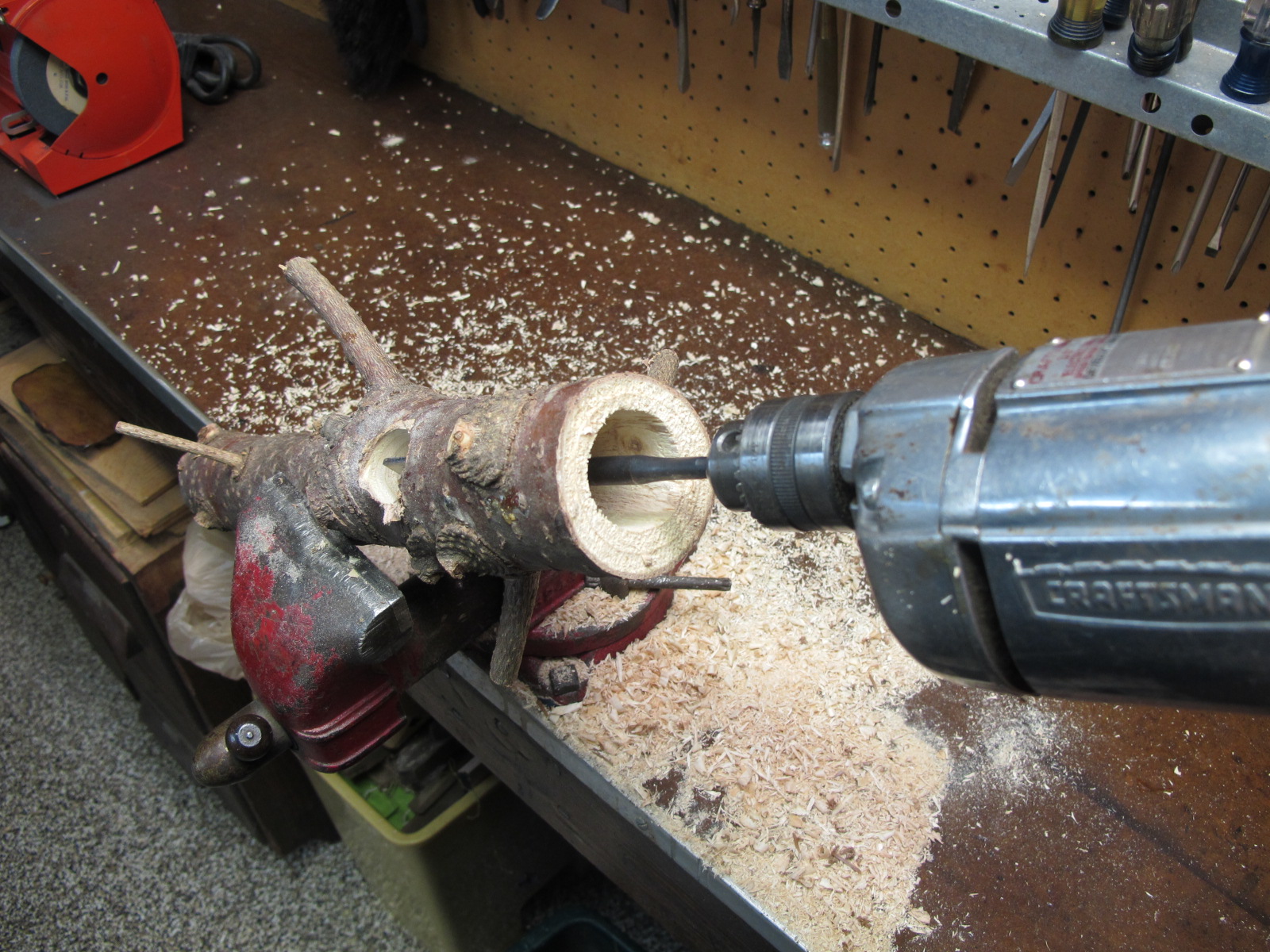  Use a vice to help hold feeder into place while drilling. 