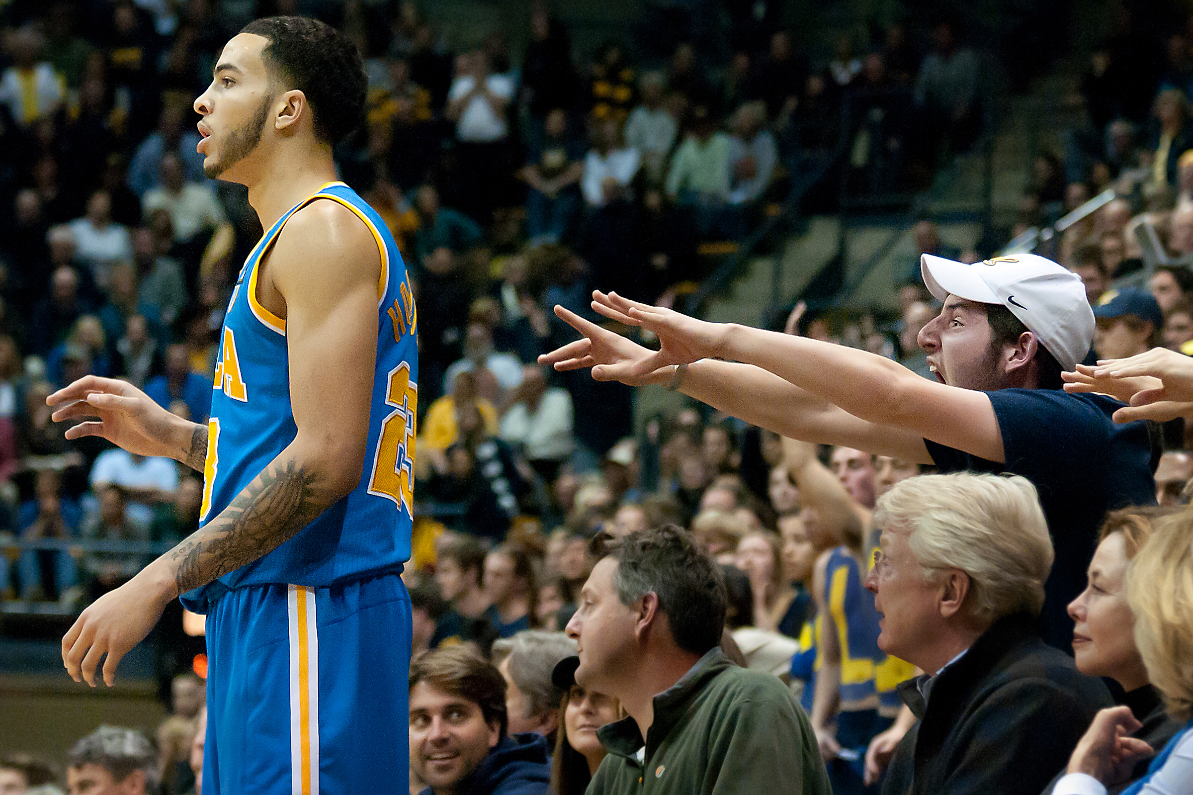  SEATTLE, WA – A fan attempts to distract Sophomore forward Tyler Honeycutt during an inbound play at Bank of America Arena on Thursday, March 3, 2011. 