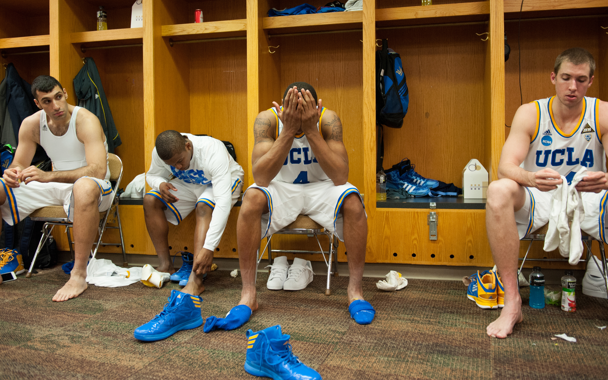  AUSTIN, TX –&nbsp;Sophomore guard Norman Powell sits with his face in his hands in the locker room after the Bruins were eliminated from the NCAA Tournament in the second round at the Frank Erwin Center on Friday, March 22, 2013. 