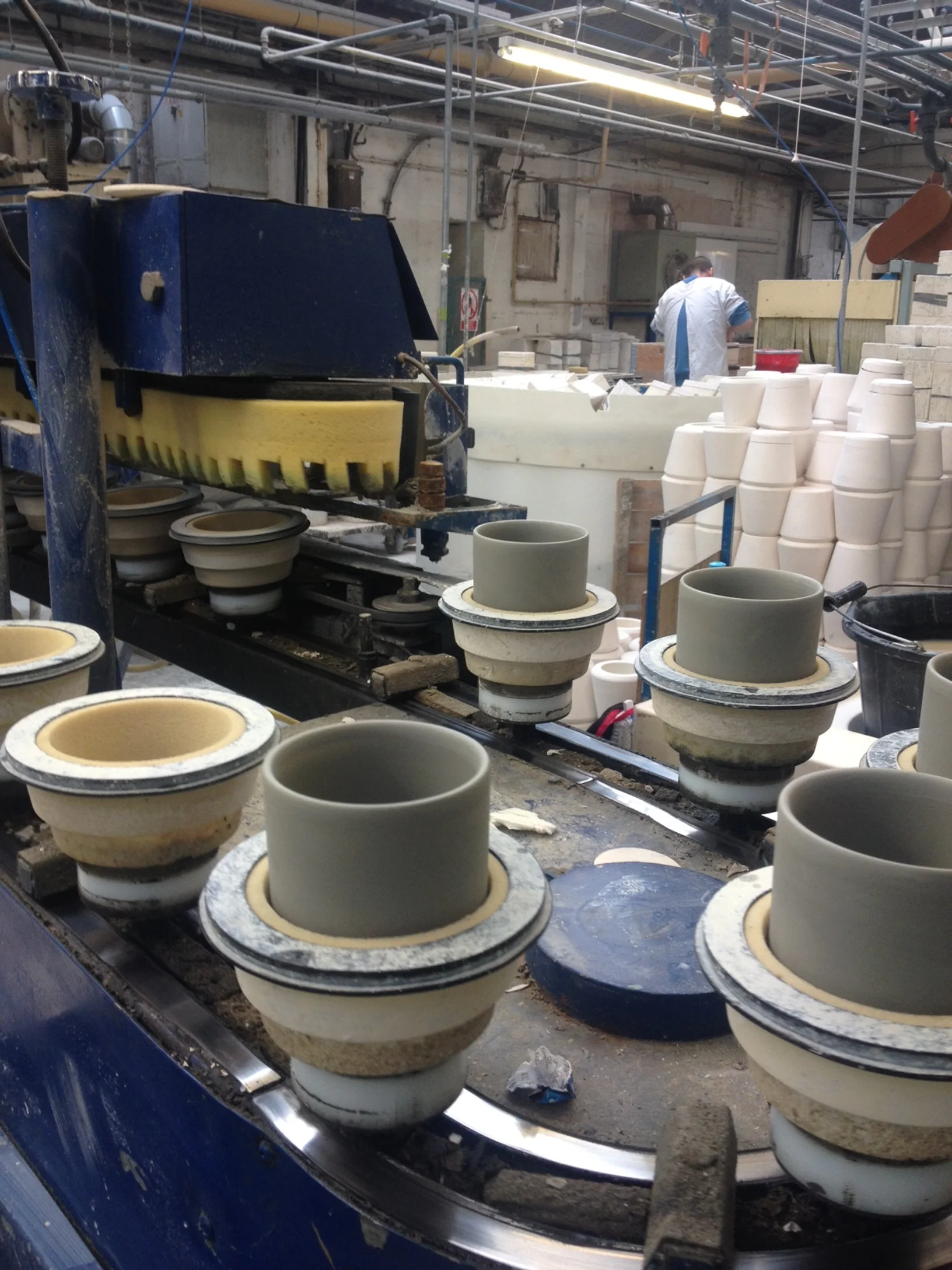 cup production, see the turreted sponge cleaning up the top of the cups