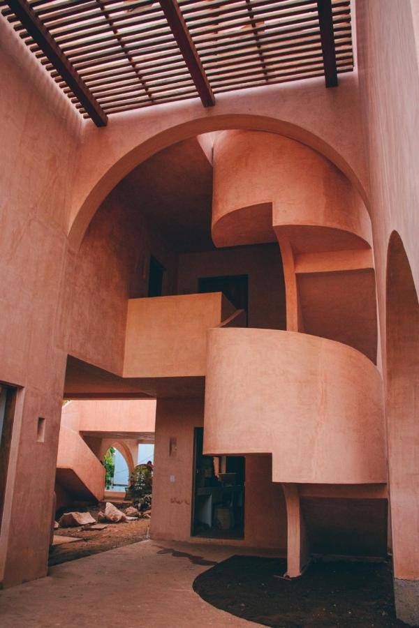 Casa_Liquen_pink_arches_spiral_staircase_Forrest_Glover_Design_Punta_Mita_Interior_design_trends_2024_Mexico.jpeg