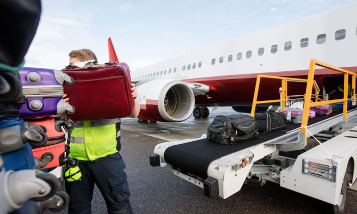 Loading An Airplane With Luggage