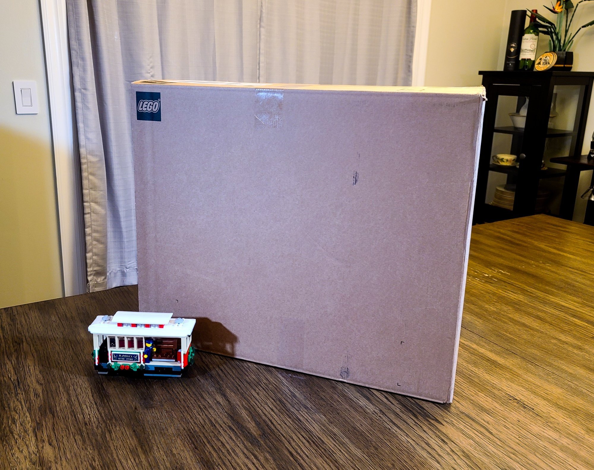 Whoa, this Christmas tree box is huge! It won’t fit in my normal build area, so I’ve commandeered the kitchen table.