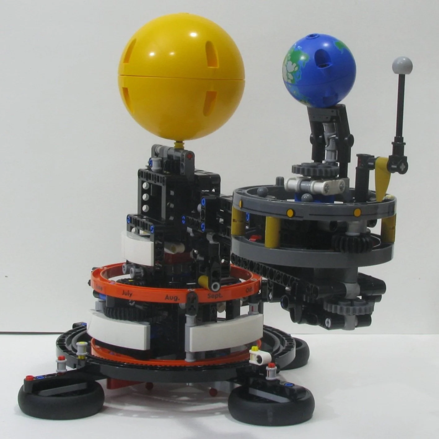 Falling Down The Gravity Well: Orbits of the LEGO Orrery