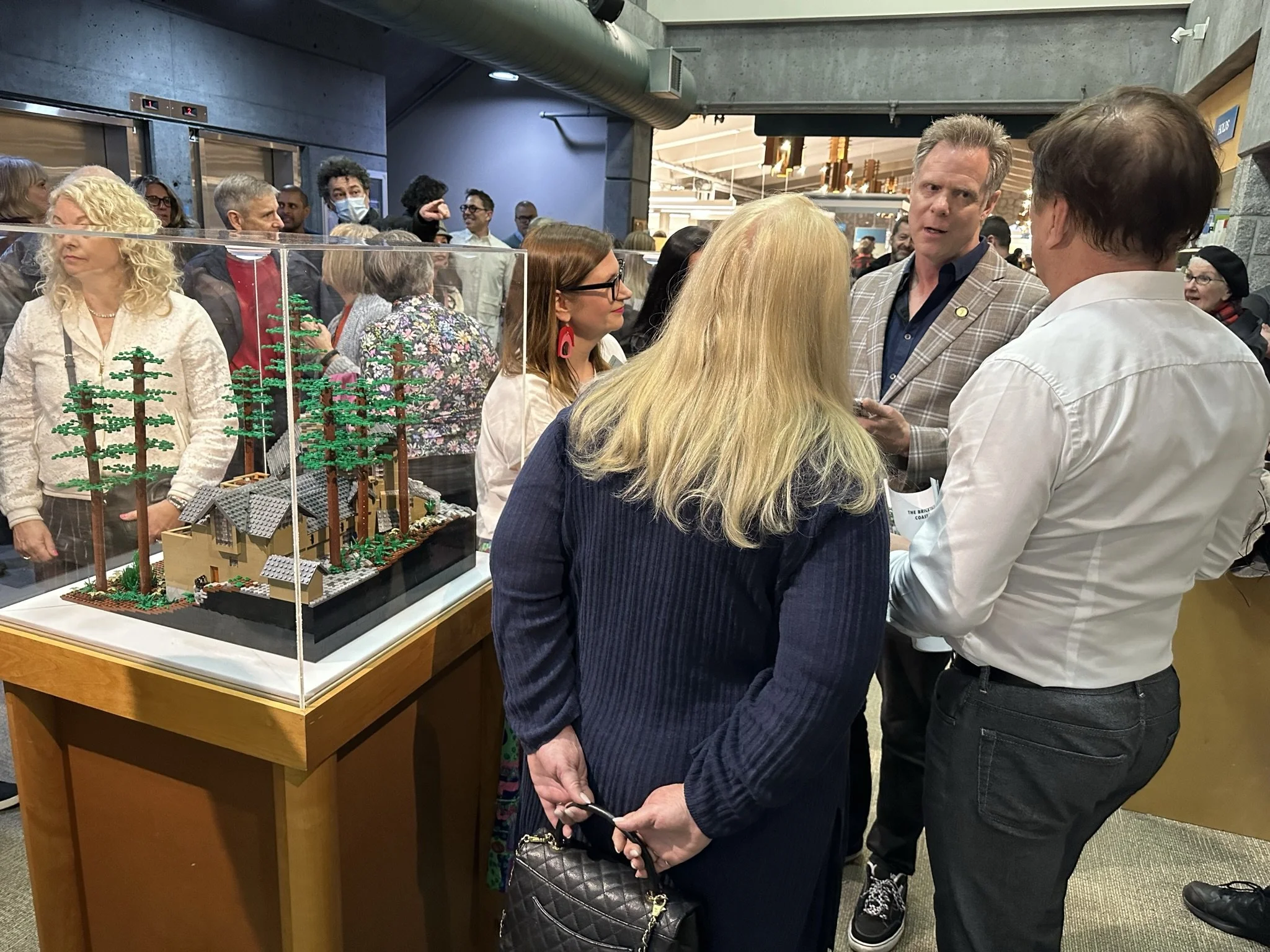  Paul speaking with some of the homeowners his LEGO models in the show were based on.  Photo Credit: Melissa Rekve 