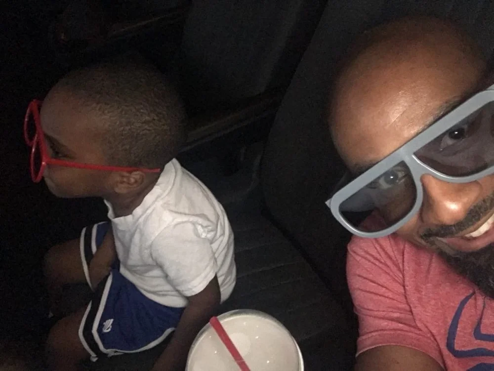  Mel and his grandson watching  The LEGO Batman Movie  - Source: Mel Brown 