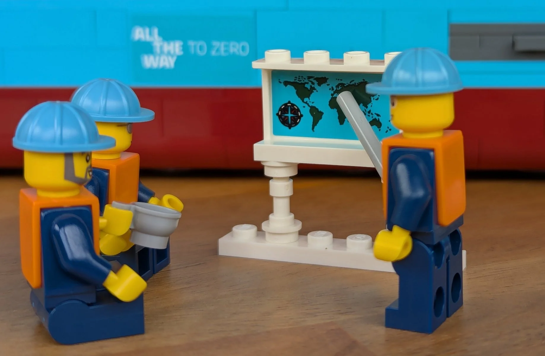 Minifigures using the map from the hidden room in the accomodation block as a whiteboard.