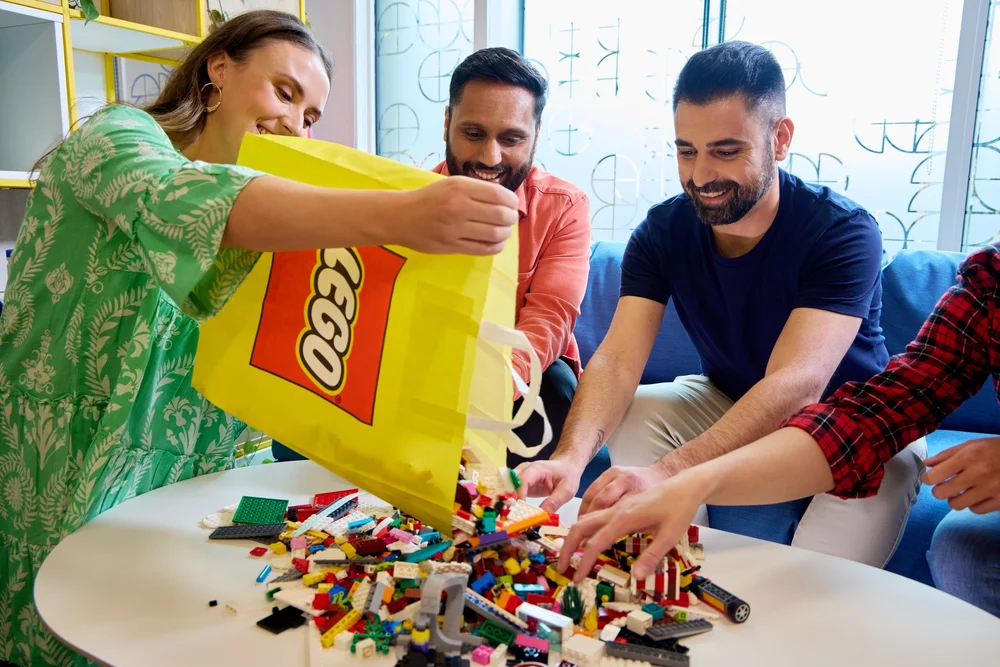 Adults Building With LEGO Toys