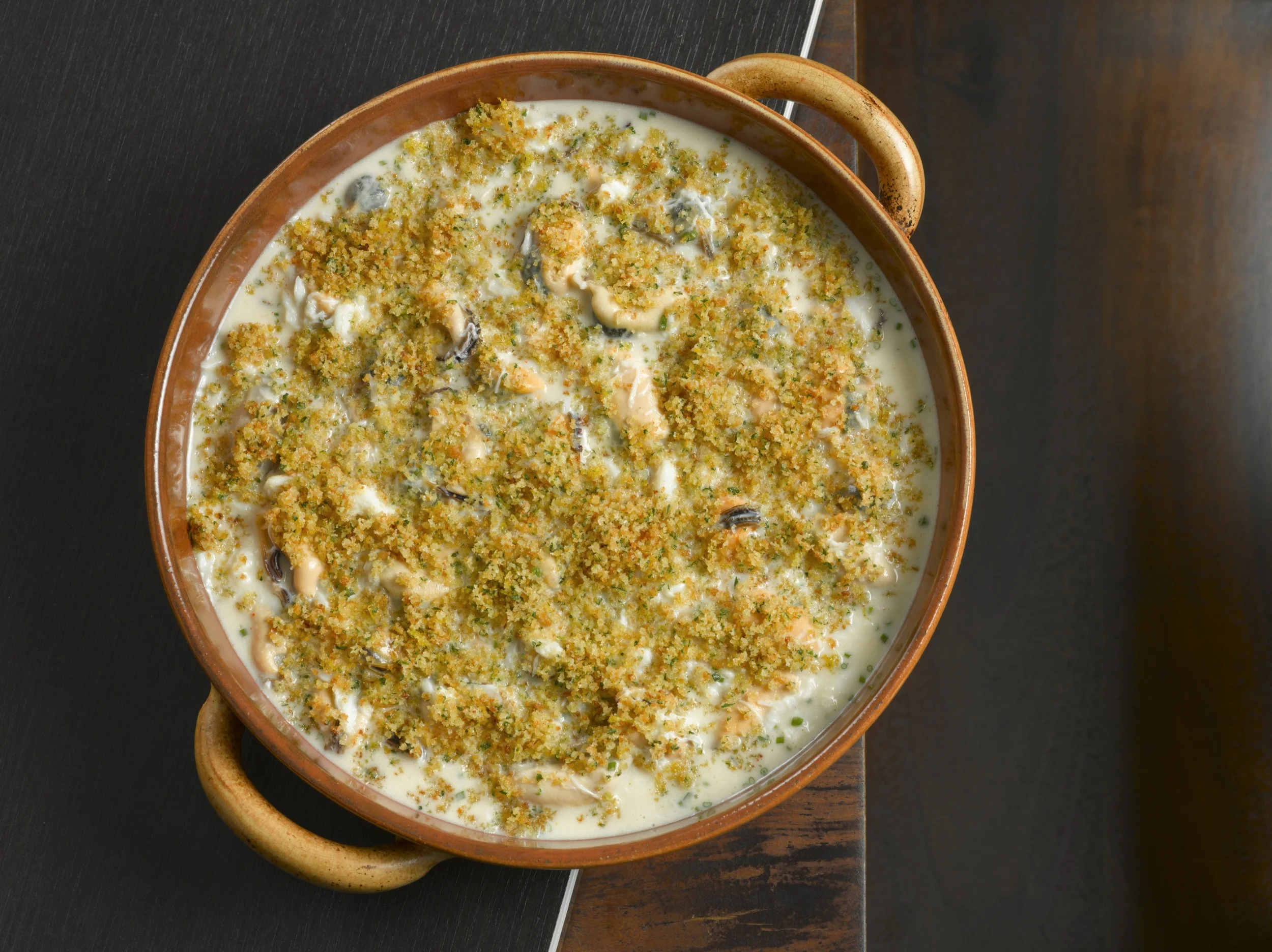 Crabe à la Toulonnaise : Decadent and buttery crab pairs well briny mussels, white pepper and a touch of cayenne.