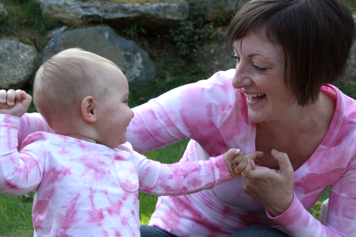 Myla with Mommy wearing homemade pink tie-dye shirts for a Breast Cancer walk.