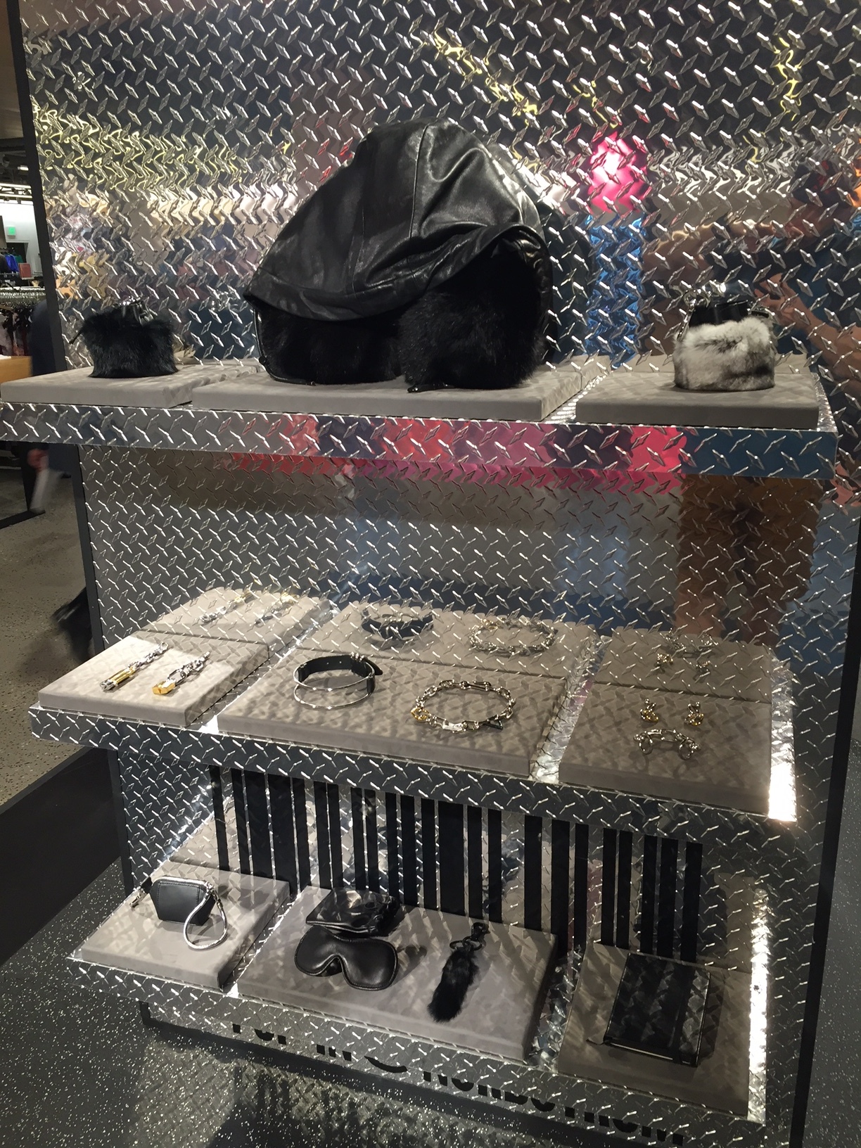 The little bag charms up top in this display are accented with rabbit fur. The travel pillow is made with black Arctic fox, and features "memory foam" in the pillow. Probably so that you'll never forget you dropped a grand for a pillow. 