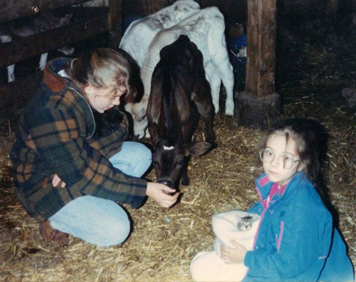 A photo my sister, Sara, posted on my wall today in honor of my birthday: "This is one of my favorite pictures of us. It feels like a bunch of our childhood memories in one fantastic picture. There are baby cows and kittens, and we are at the dairy farm next door to my grandparent's place in Millersburg, Ohio. Also, Aimee and I look fabulous. I miss you baby sister! I wish we got together more."