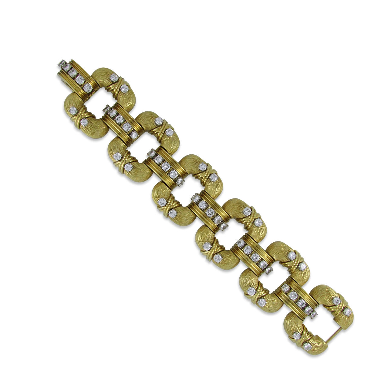  18KT textured yellow gold bracelet with six domed and textured rectangular links each prong-set with four round diamonds; connected with ribbed polished yellow gold links prong-set with five round diamonds.&nbsp; The total weight of the 54 diamonds 