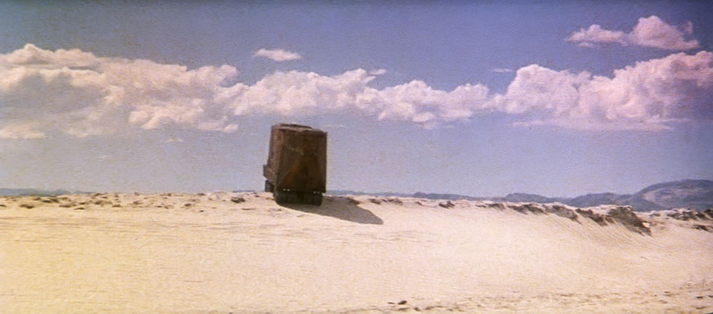 EXT. TATOOINE - LAR'S HOMESTEAD - SALT FLAT - AFTERNOON