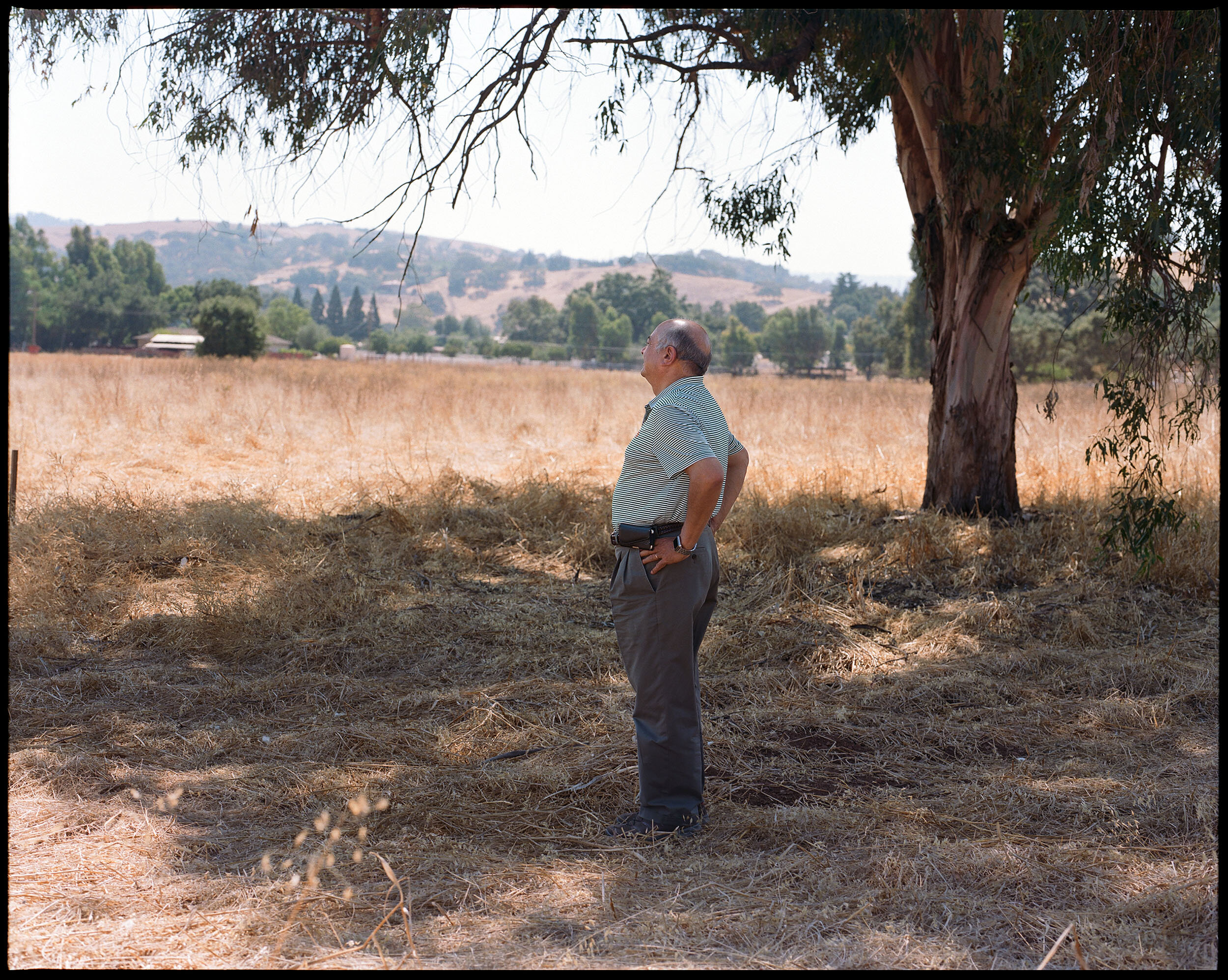  Community leader Hamdy Abbass looks out at the land that he hopes will be the site of his mosque, community center, and burial ground. “It will be beautiful," he says. 