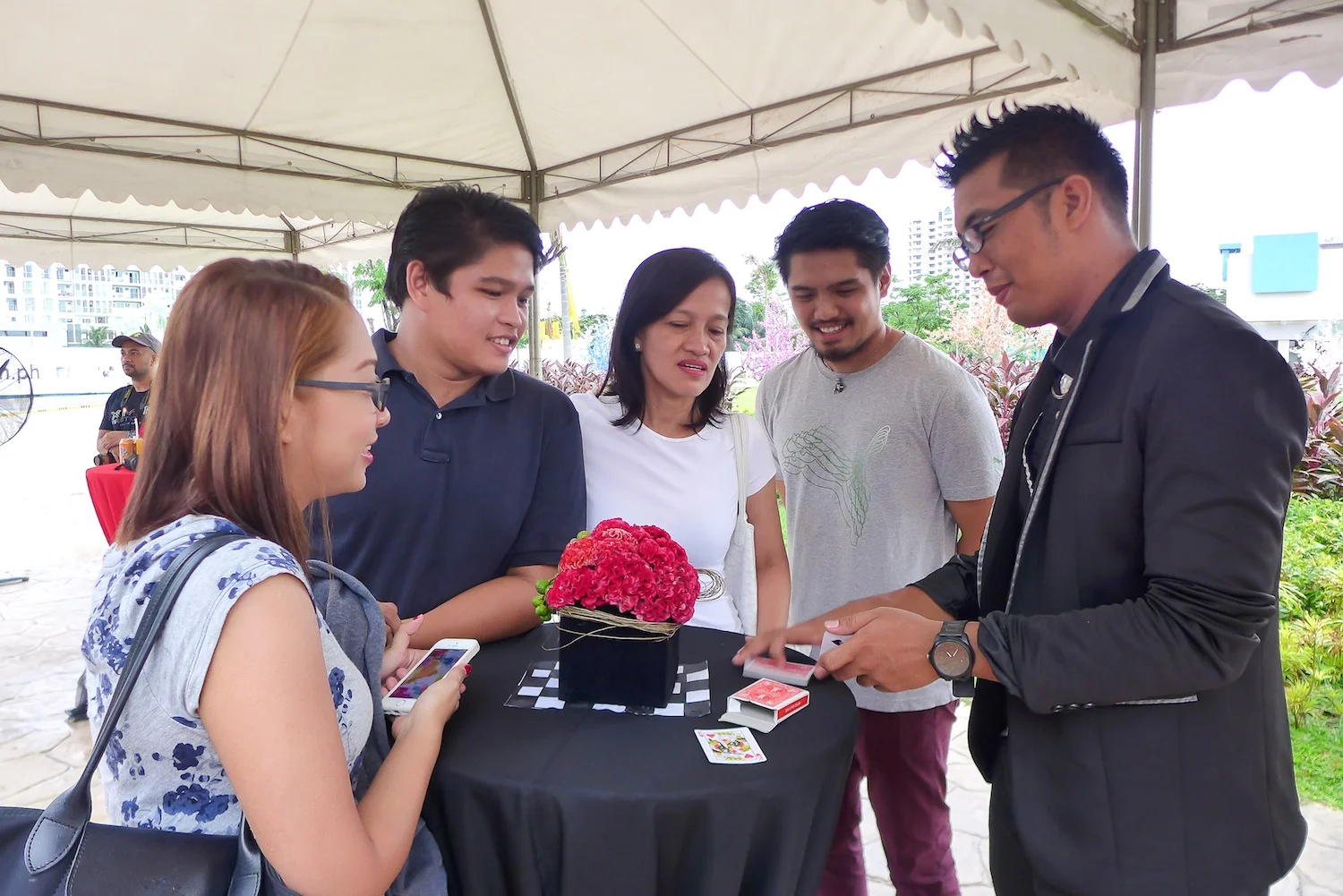 My family focused on the magic being performed by this talented street magician.