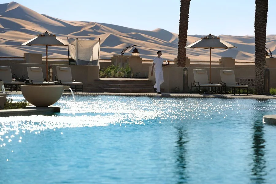 QASR AL SARAB RESORT BY ANANTARA ABU DHABI, UNITED ARAB EMIRATES Water is a recurring theme throughout this sprawling 206-room desert resort, from the terra-cotta jars outside the entrance (traditionally provided by locals for travelers to quench their thirst) to the tranquil stream running through the arid grounds. Not surprisingly, then, the swirling free-form pool is one of the hotel’s defining features—set among towering palm trees and otherworldly sand dunes, it is a true oasis. qasralsarab.anantara.com