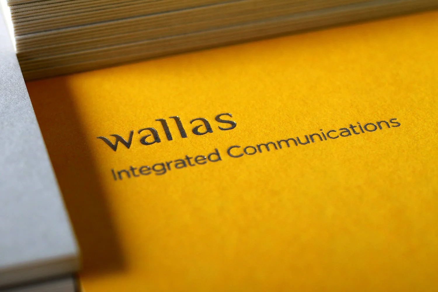 Branding identity design for Wallas Inc, an integrated agency in SG - Foil-stamped logo on Business cards.