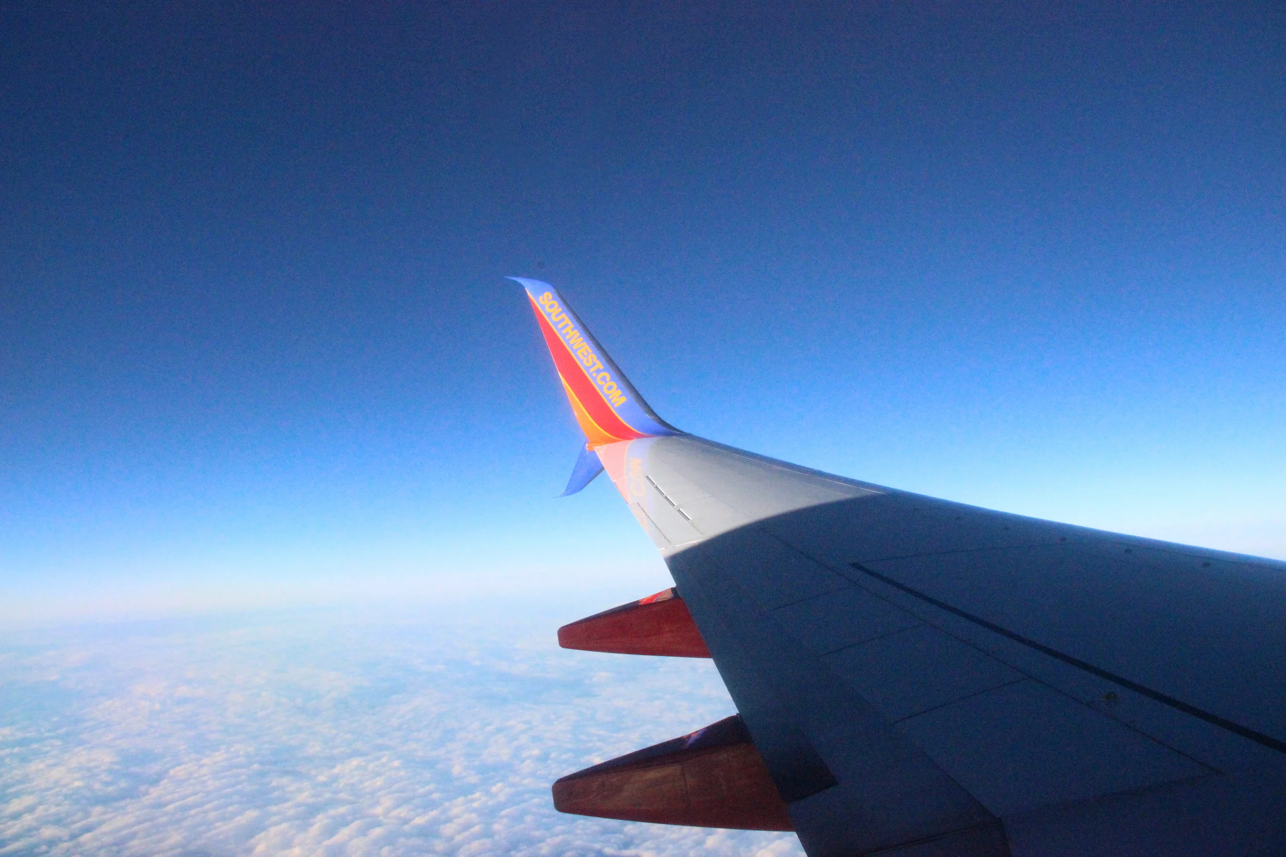 I am such a sucker for photos of airplane wings over cotton-candy clouds.