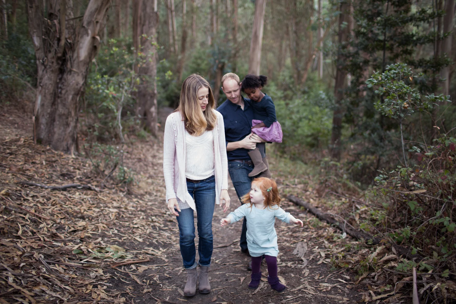 family walk through the woods