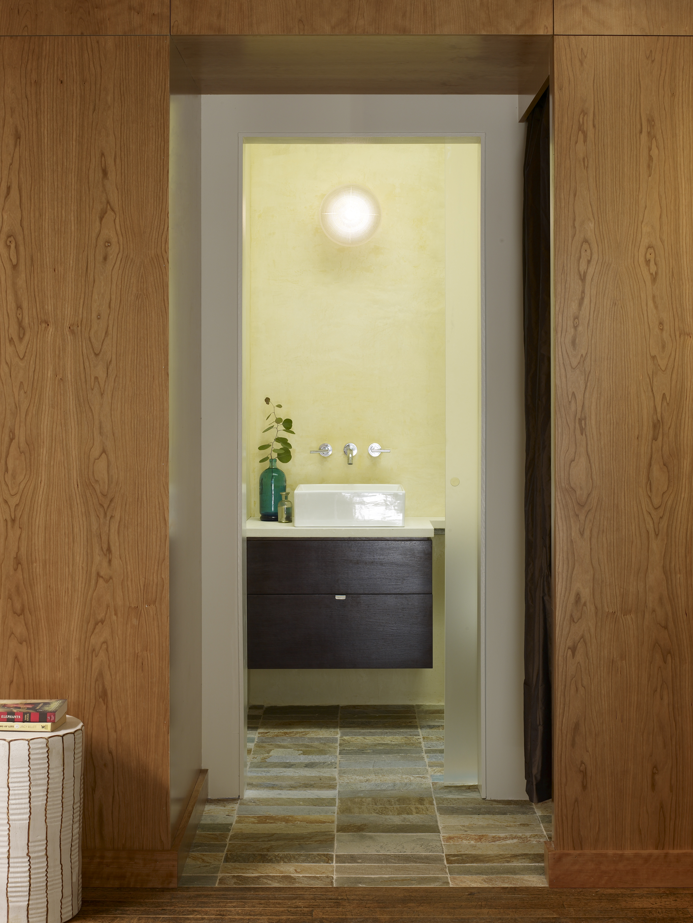 The bathroom where a skylight above doubles as a rooftop table.