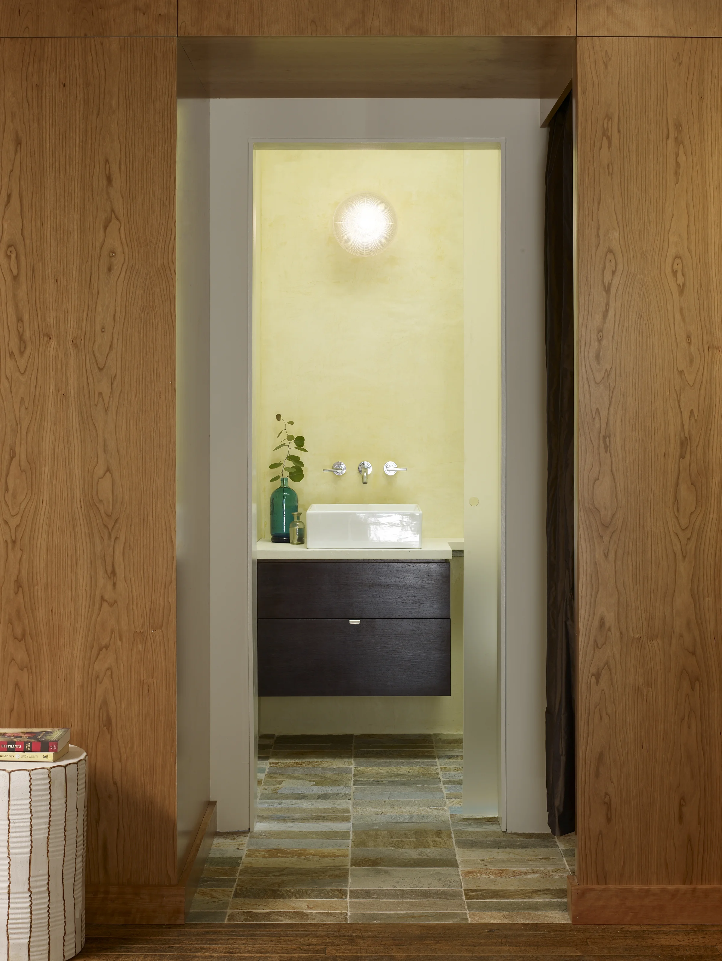 The bathroom where a skylight above doubles as a rooftop table.