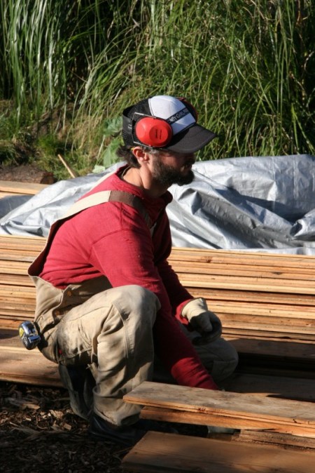   Jesse surveys the boards prior to the burning process.  