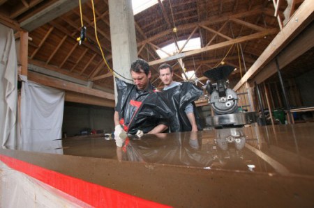   After the molds have been removed, Justin and Jerad begin the polishing process with a Diamond embedded grit pad.  