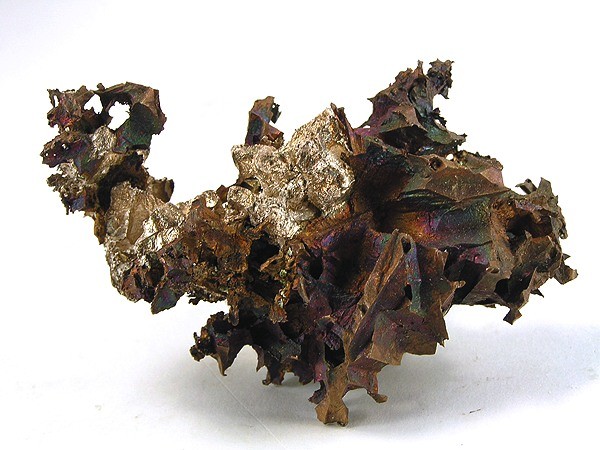 Copper and Silver from the Adventure mine, Greenland, Ontonagon County, Michigan, USA. This specimen is not called a "half-breed" because the copper and silver are not densely intermixed, but intergrown. Beautiful contrast of the iridescent copper and shiny silver which has formed crude crystals instead of the usual "lump" upon copper most half-breeds come as.