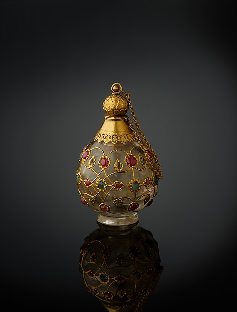Source: The Met. Date:1650–1700, North India. Medium: Rock crystal, inlaid with gold wire, rubies, and emeralds, with gold collar, stopper, and foot.