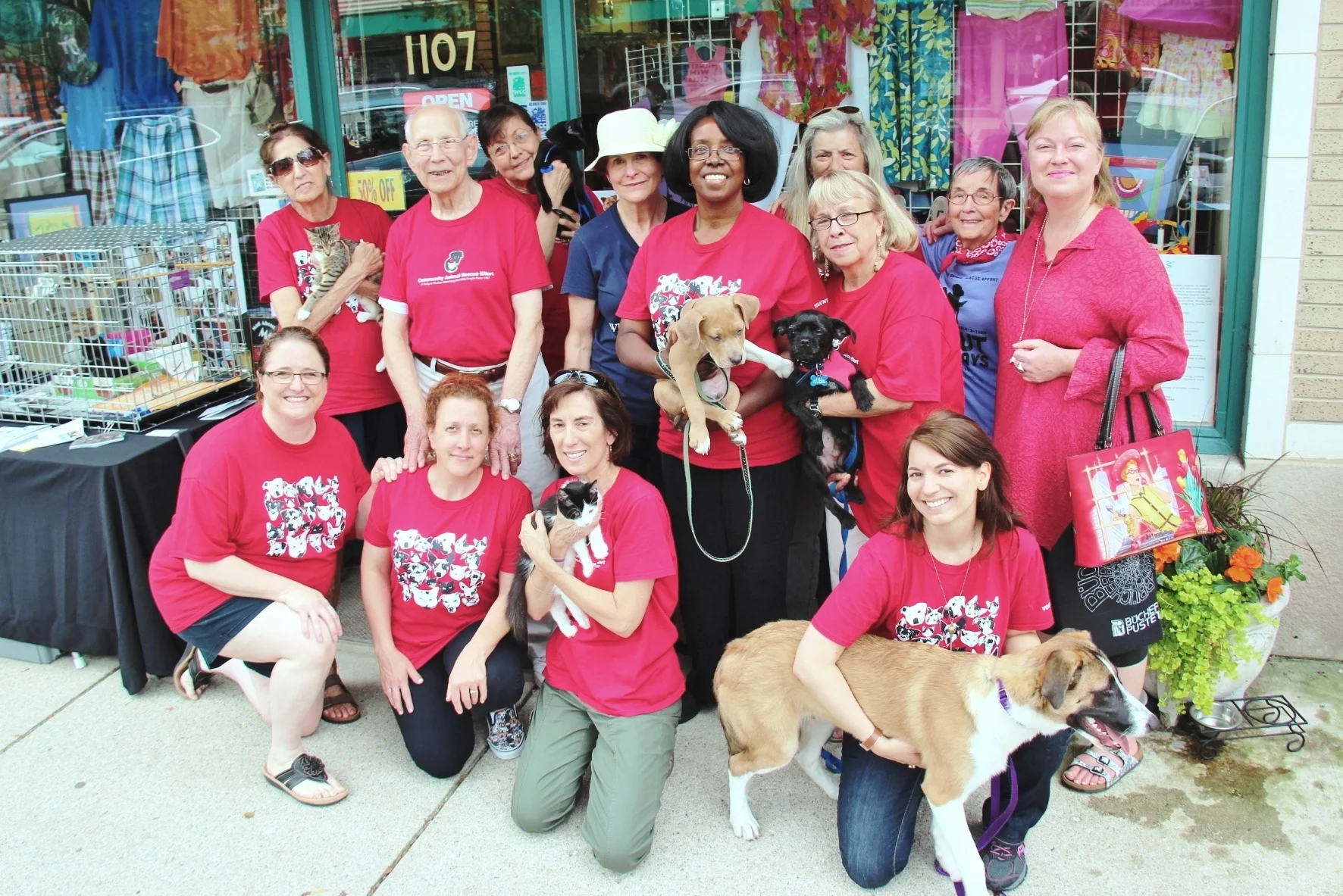Pauline (back row, left) was an important part of the C.A.R.E. Red Shirt Crew that goes out into the community on weekends to find homes for homeless animals.
