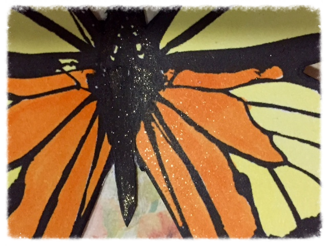 The glitter pen, Wink of Stella clear, was hard to capture in the above photos. This image gives you a better idea of how shimmery the butterfly appears up close. 