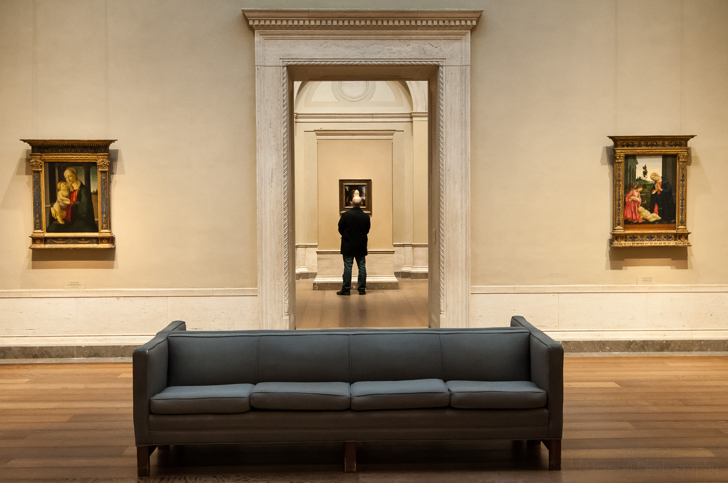 A visitor viewing Leonardo da Vinci's Ginevra de' Benci . On the left is Madonna and Child by Sandro Botticelli. On the right is The Adoration of the Child by Filippino Lippi. Again, I love the layout of the museum. I consider that artwork, as well.
