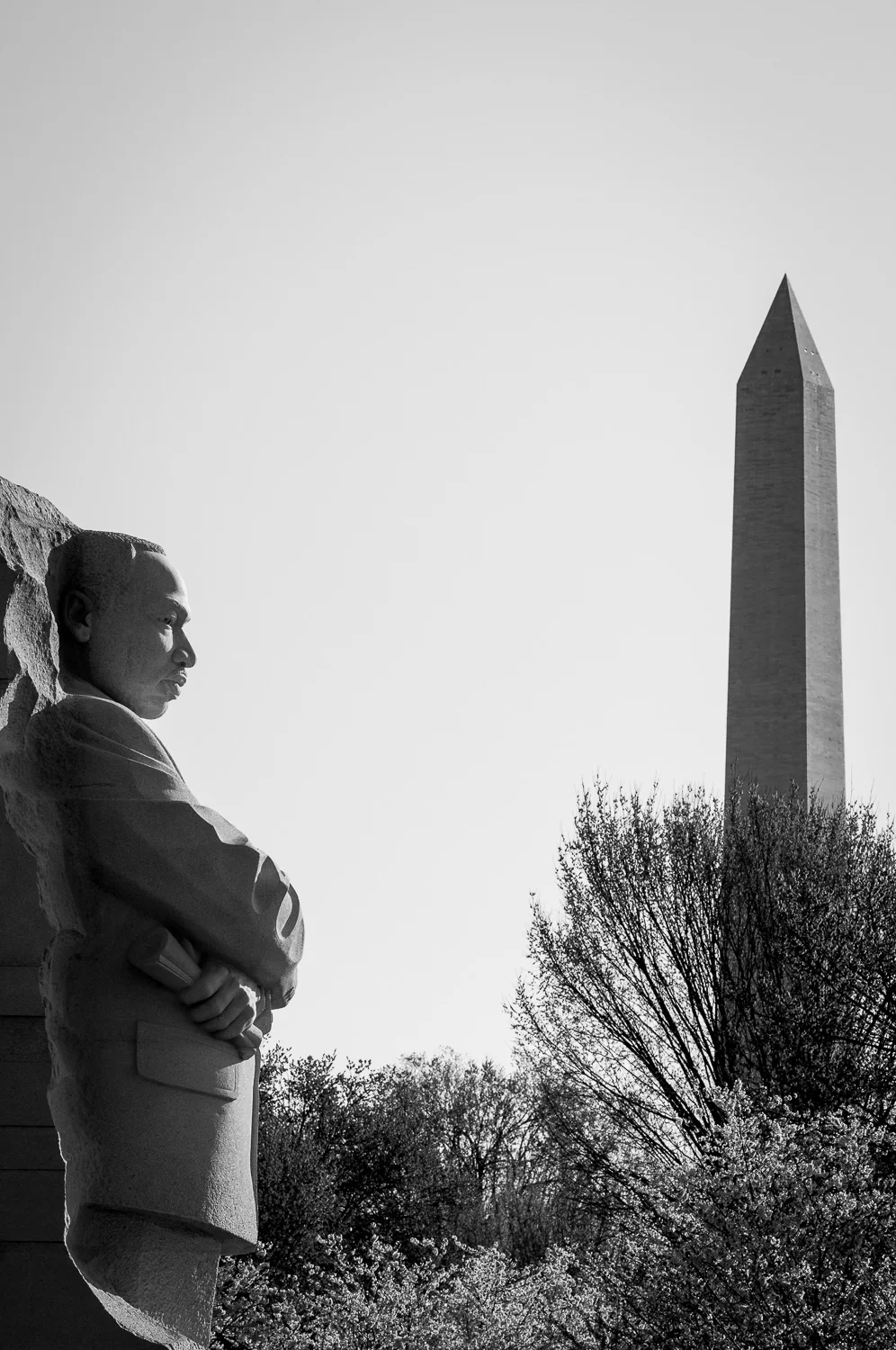 Black and white photo of Martin Luther King, Jr. Memorial and Washington Monument.