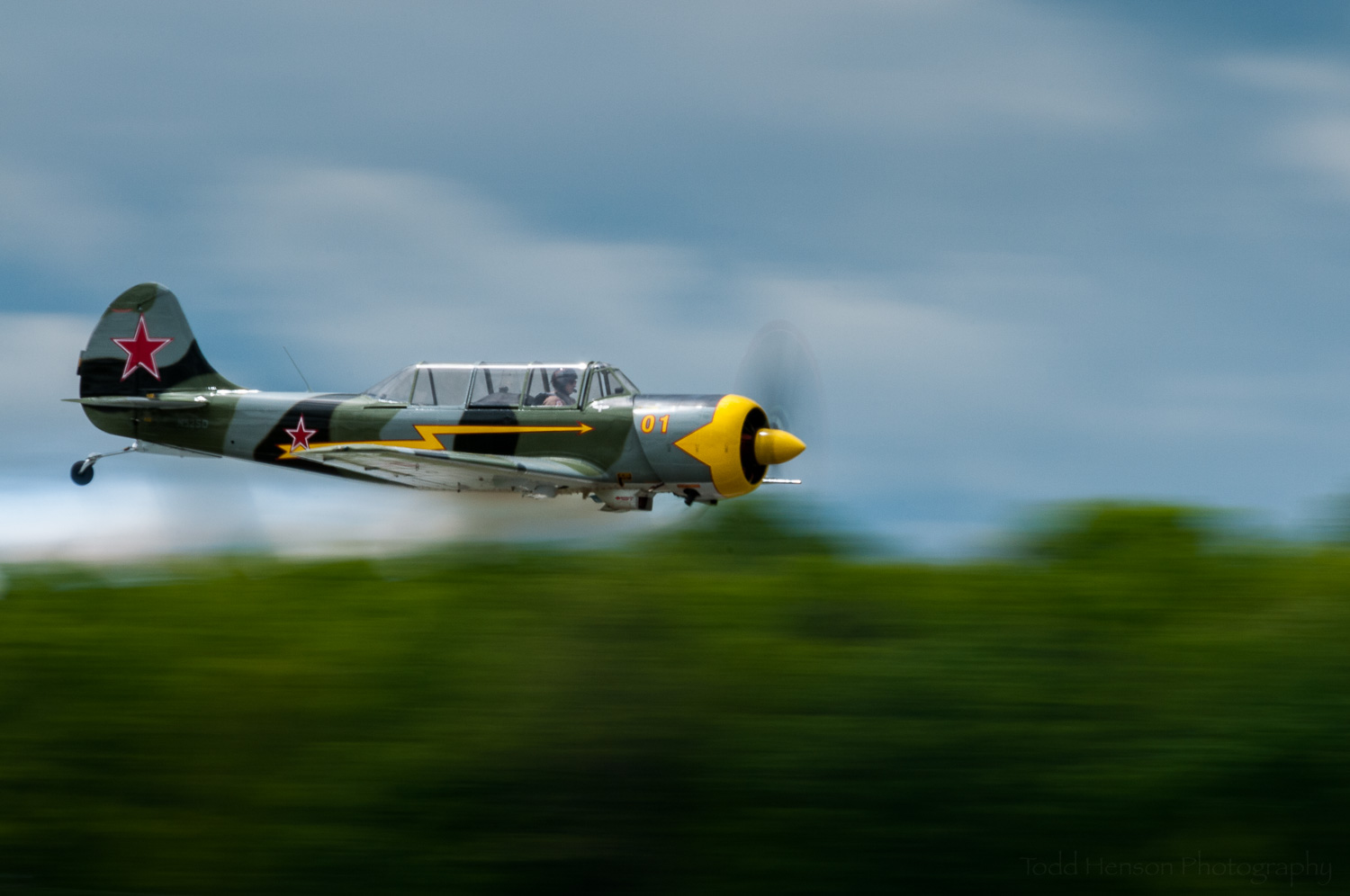 Yak-52 Flyby. Pilot: Charlie "V+12" VandenBossche. Camera settings: 400mm, 1/50 sec, f/29
