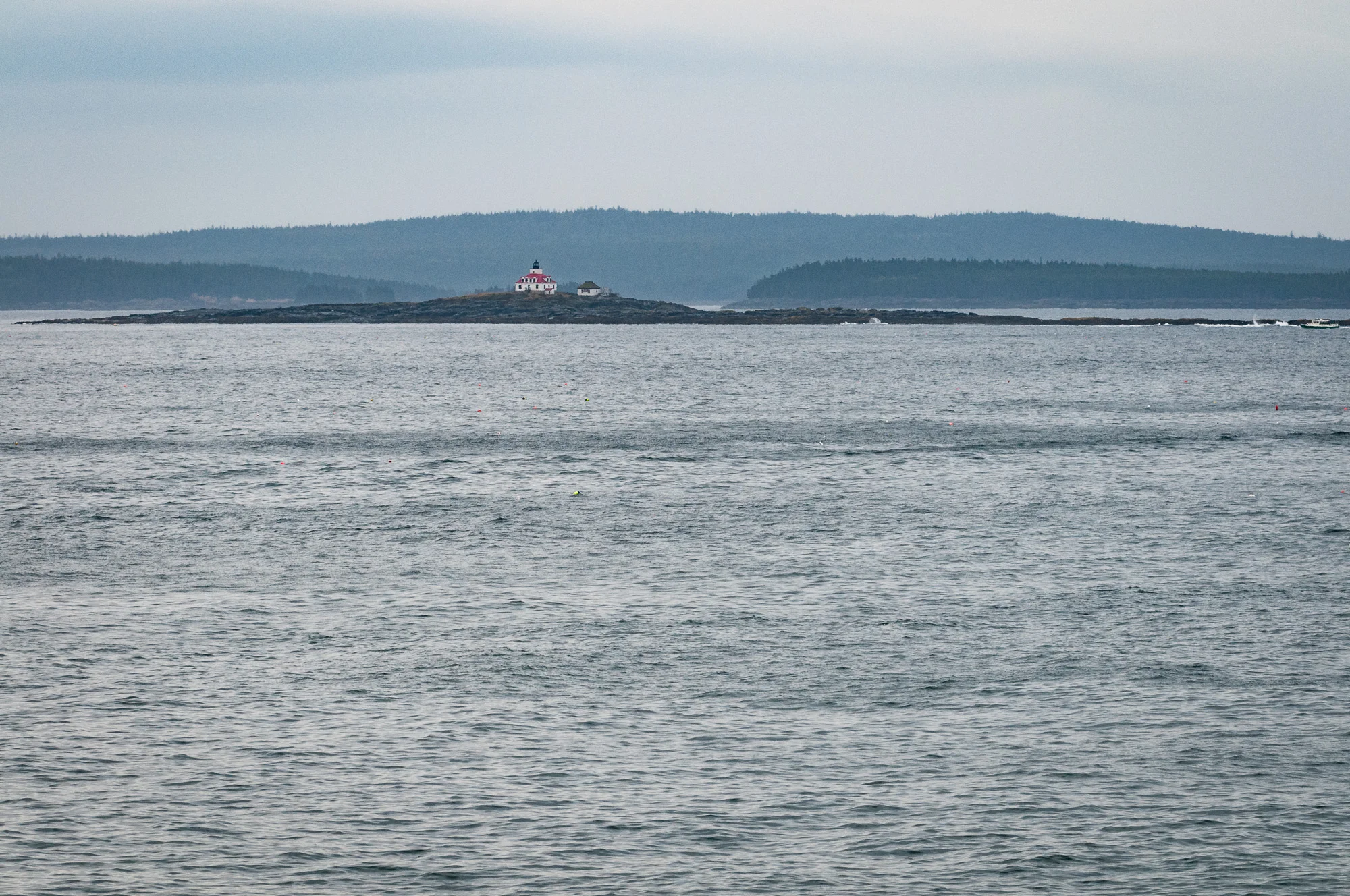 Wider view of Egg Rock Light from base of rocky overlook at the end of the paved trail, processed to reduce mist. (140mm focal length)