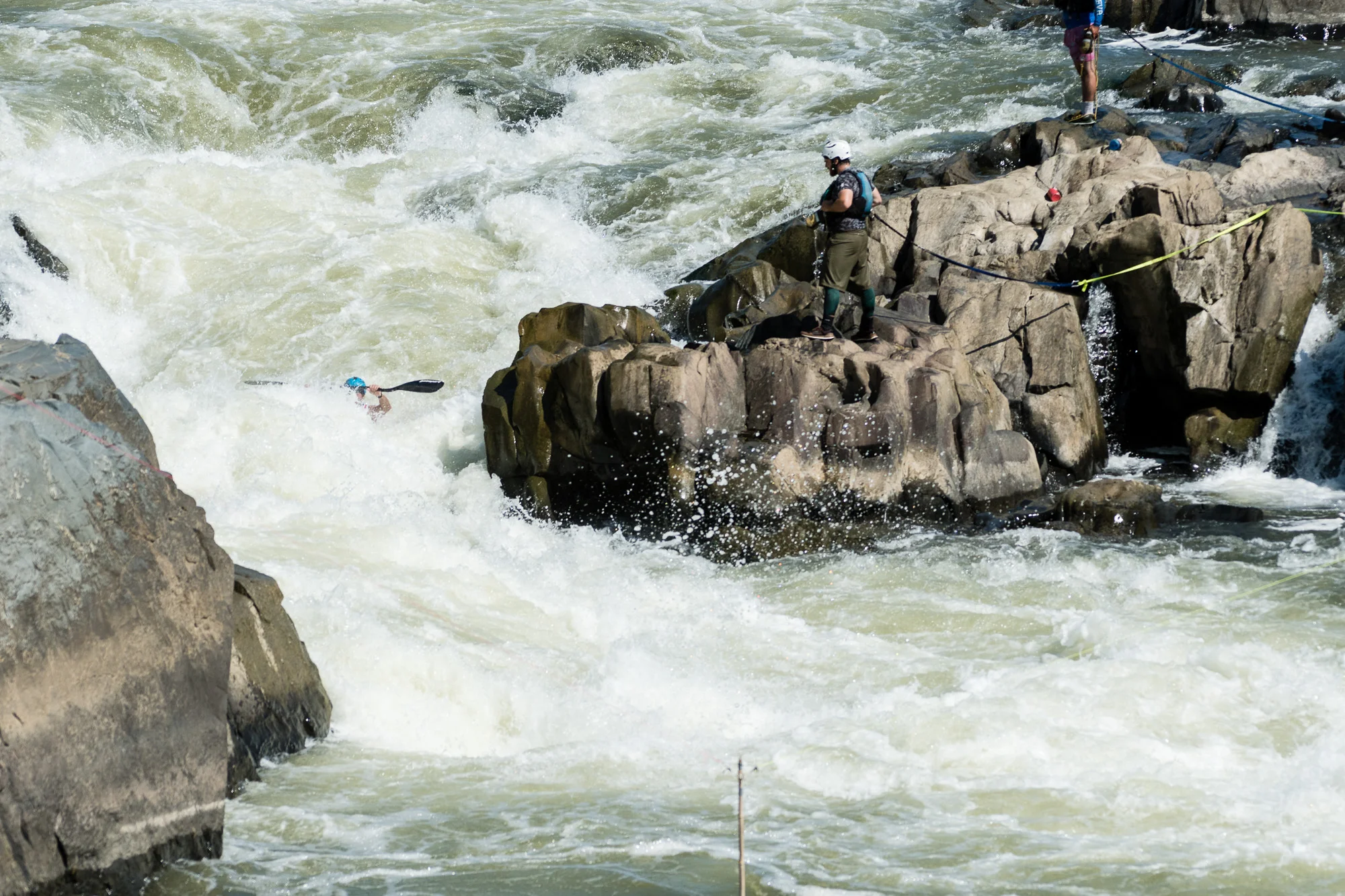 During the slalom event Jason Beakes almost disappears behind the wild water in S-Turn. The 2nd slalom gate can be seen at the bottom.