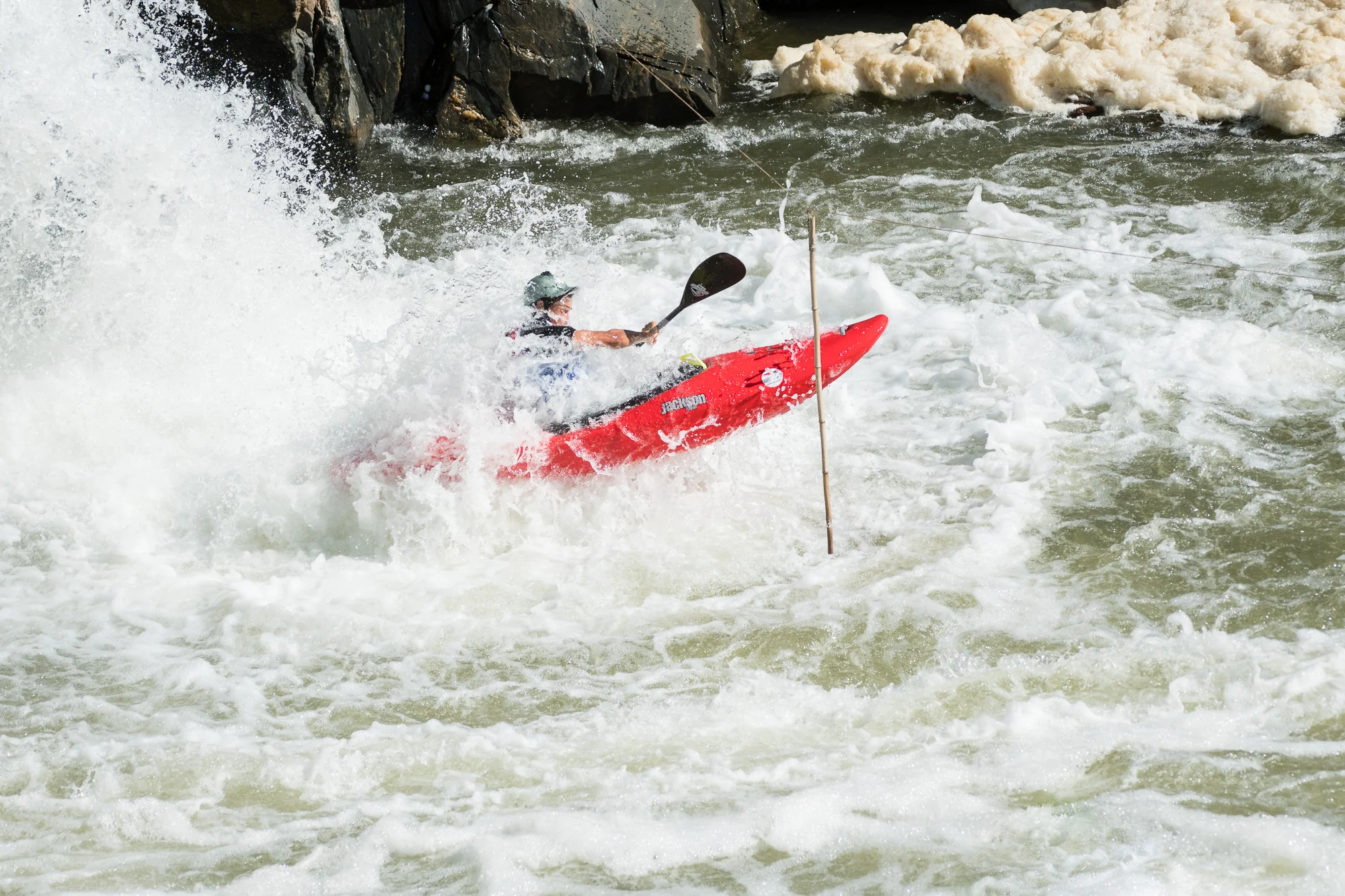 Tyler Uthus flying past the final slalom gate.