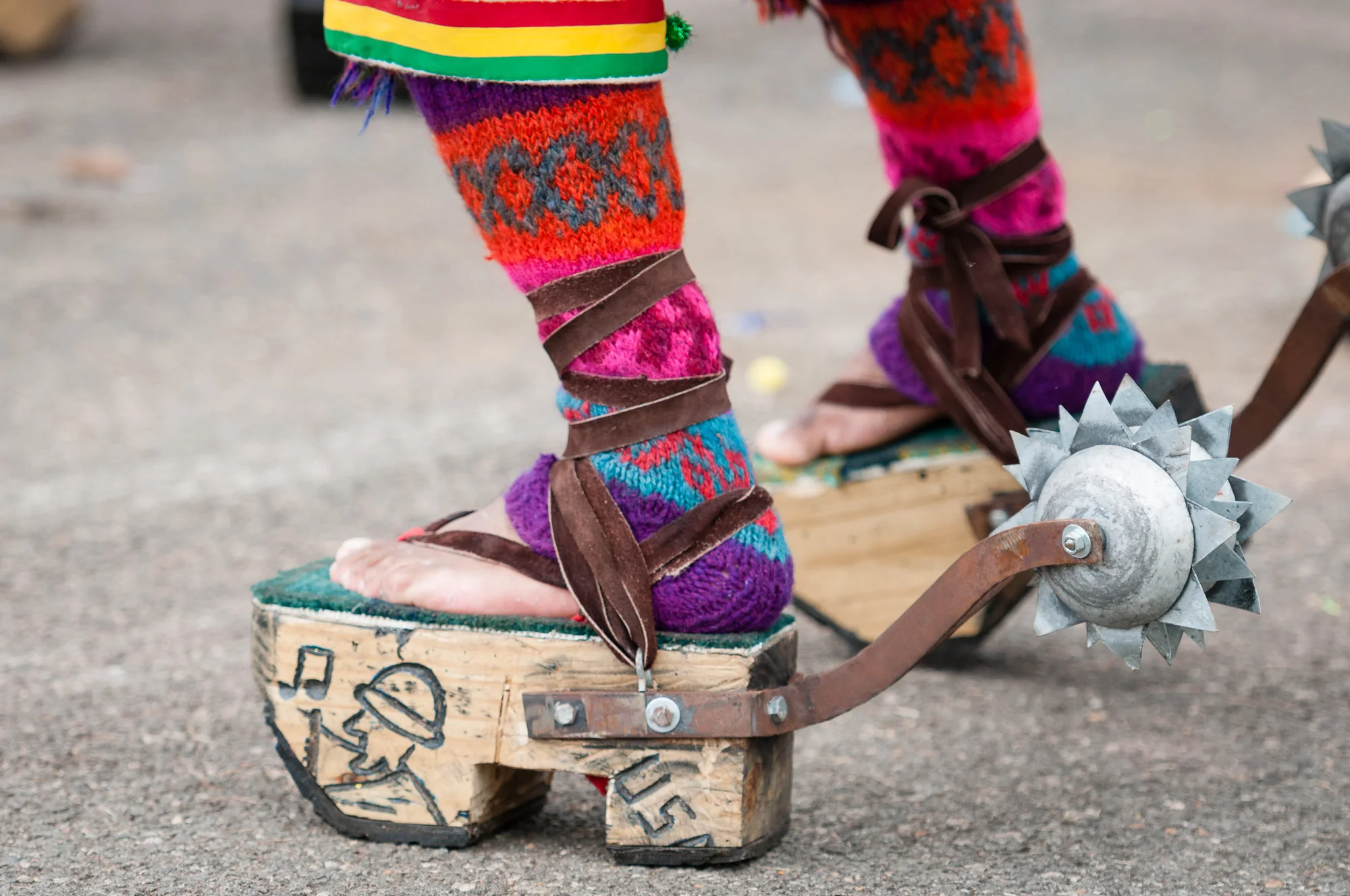 Look at the details in the footwear of a member of Centro Cultural Pujllay Cliza USA.