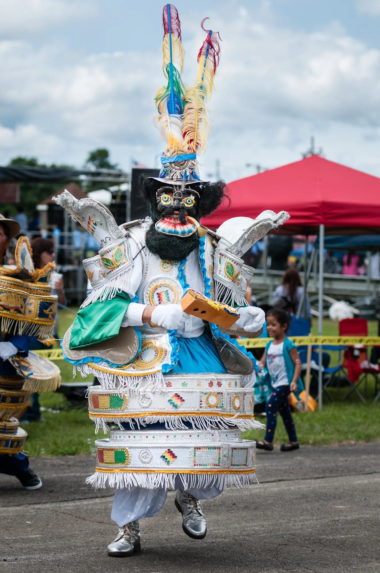 It was a hot day and I have to imagine this performer from Embajadores del Folklore was feeling the heat while performing a Morenada dance in a full costume.