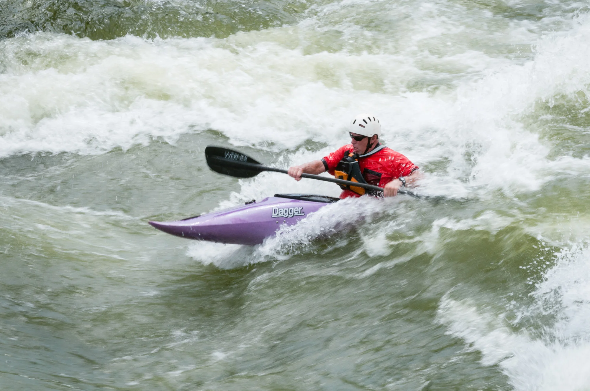 Riding the wave. A shutter speed of 1/100 sec is a nice balance between slow and fast.