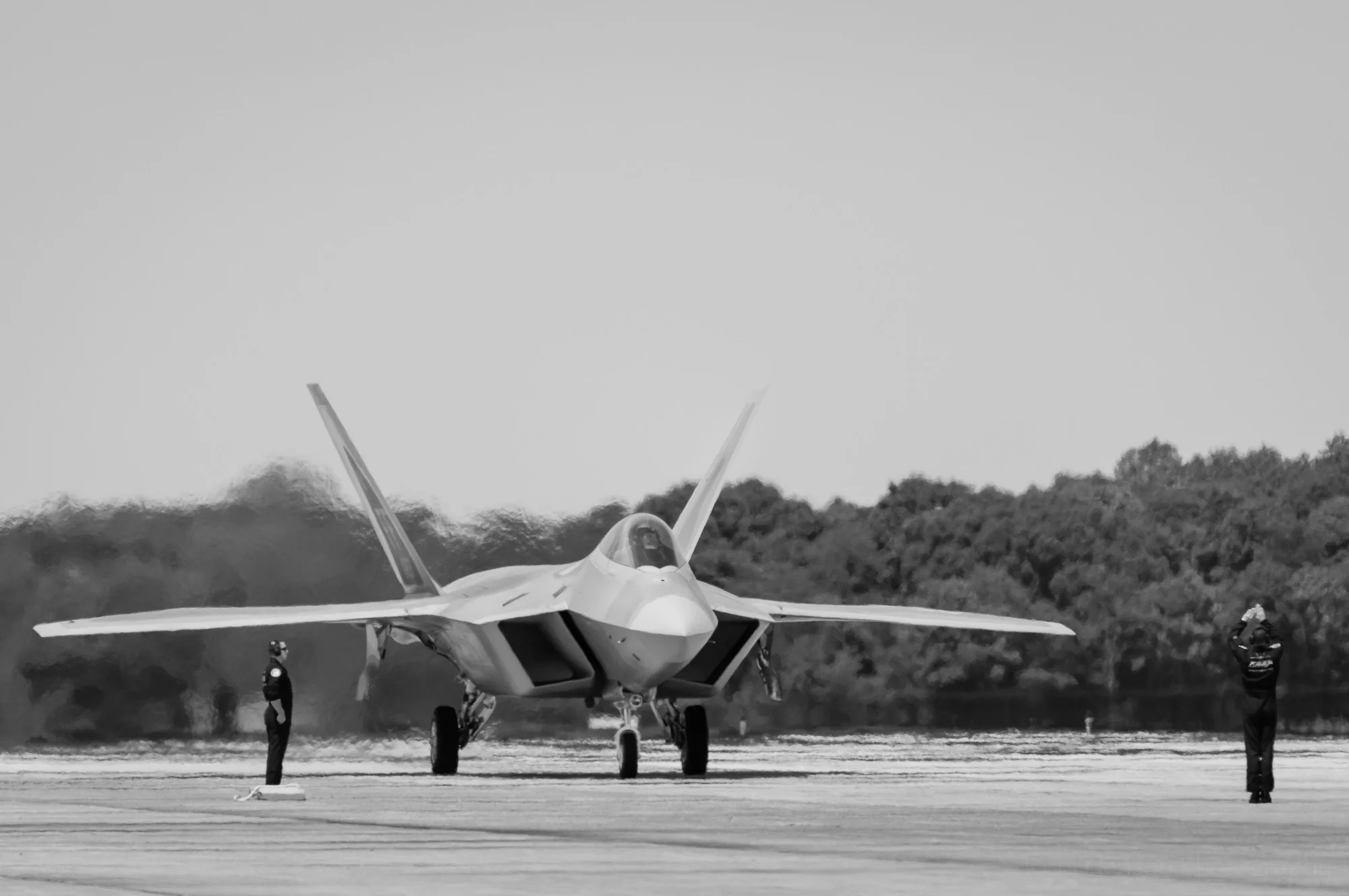 USAF F-22 Raptor taxiing on the runway.