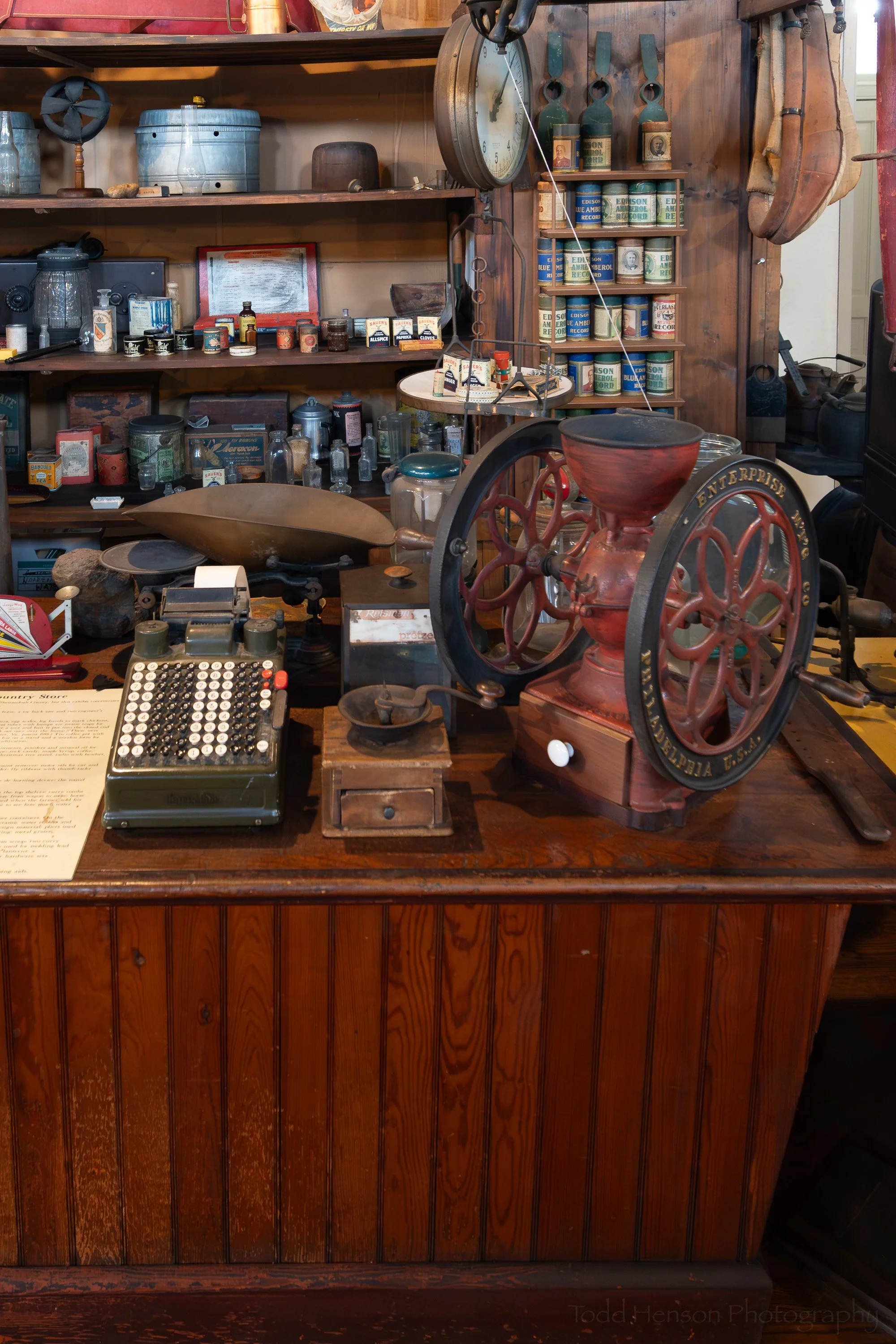 A cash register, coffee grinders and some scales